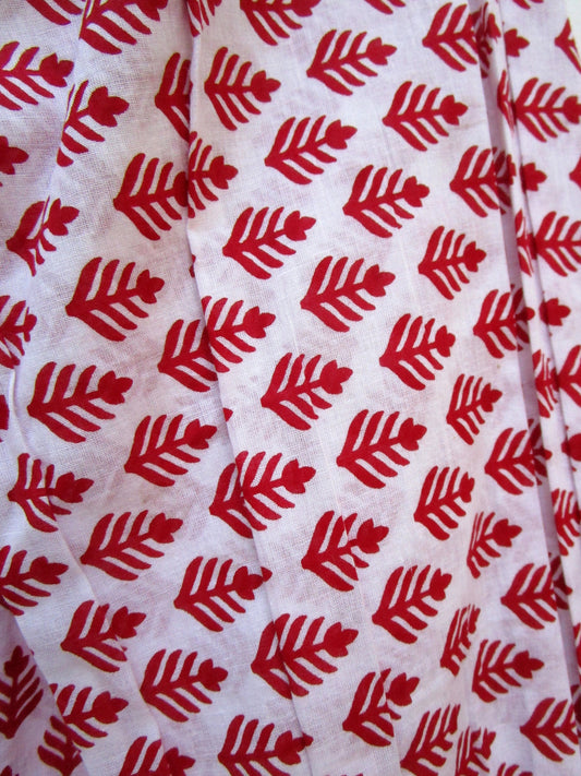 red and white blouse with tassels and a paisley border