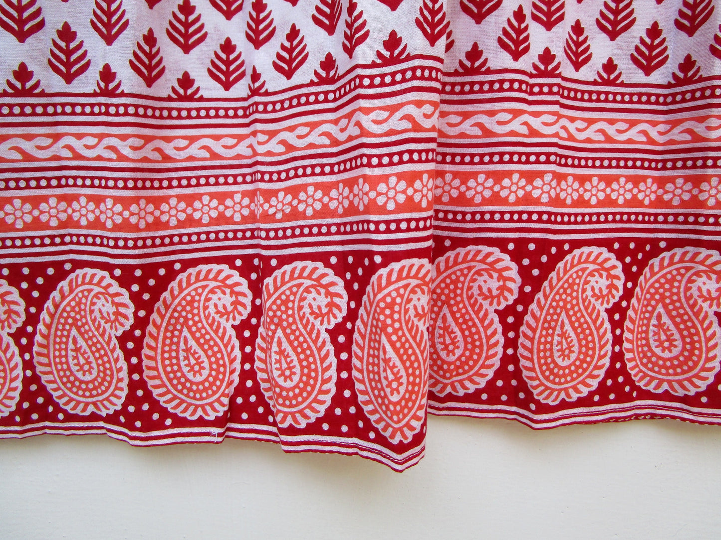 red and white blouse with tassels and a paisley border