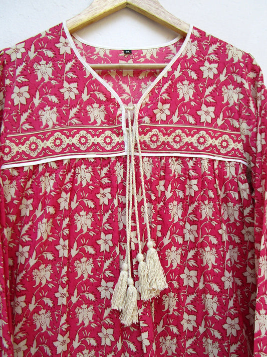 red floral womens blouse with off-white tassels.