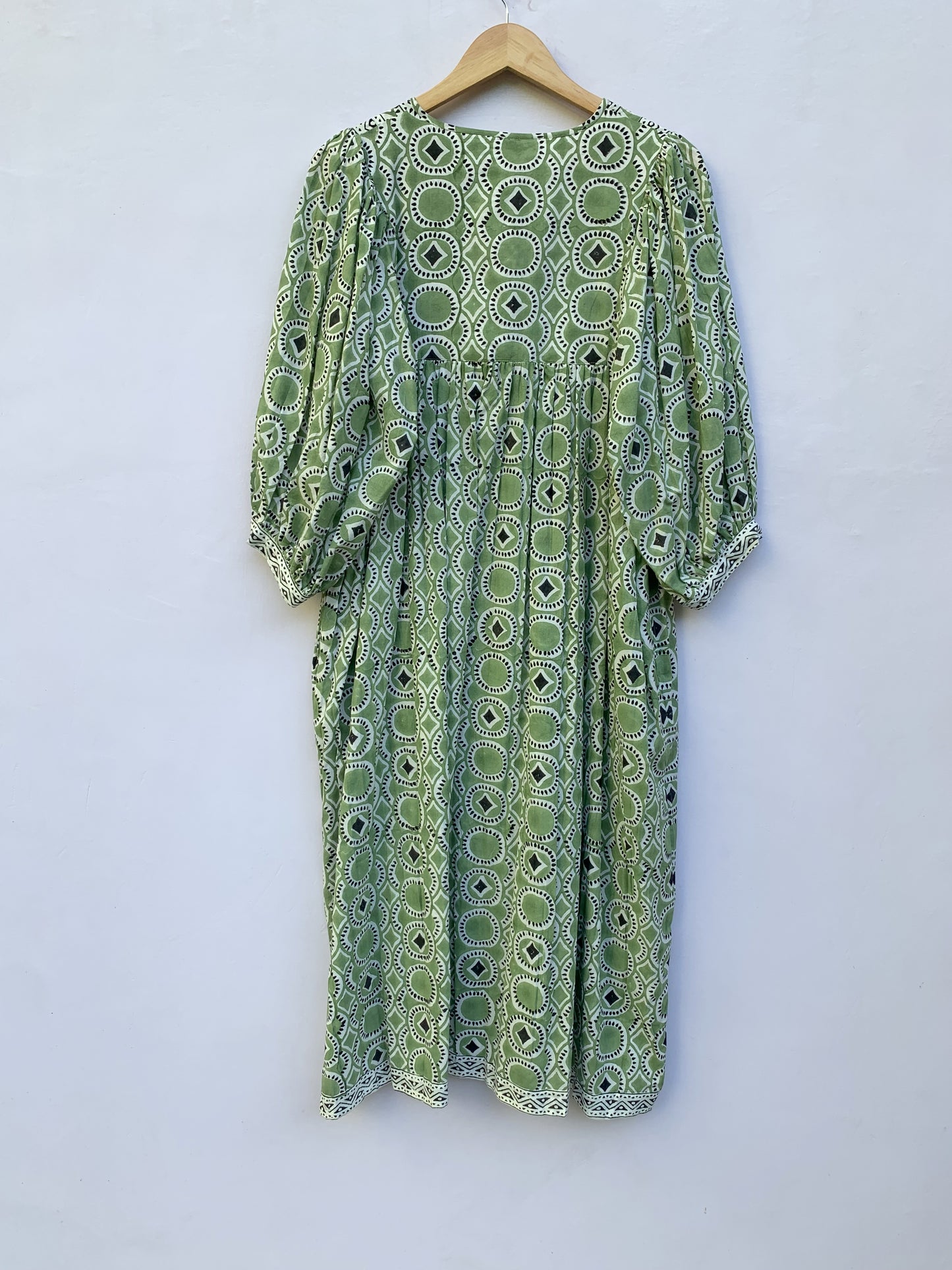 green mini dress with round and diamond pattern