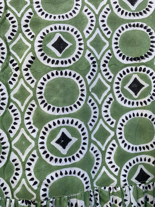 green mini dress with round and diamond pattern