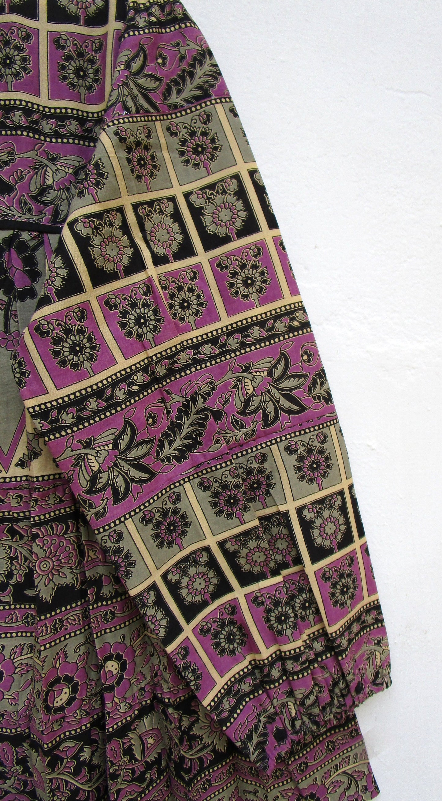 purple womens blouse with black and beige detailing