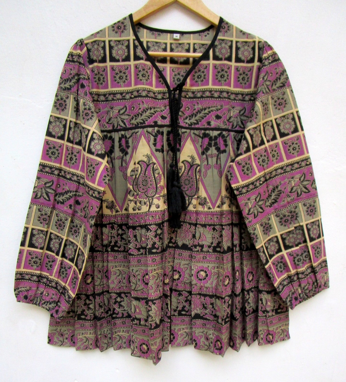 purple womens blouse with black and beige detailing