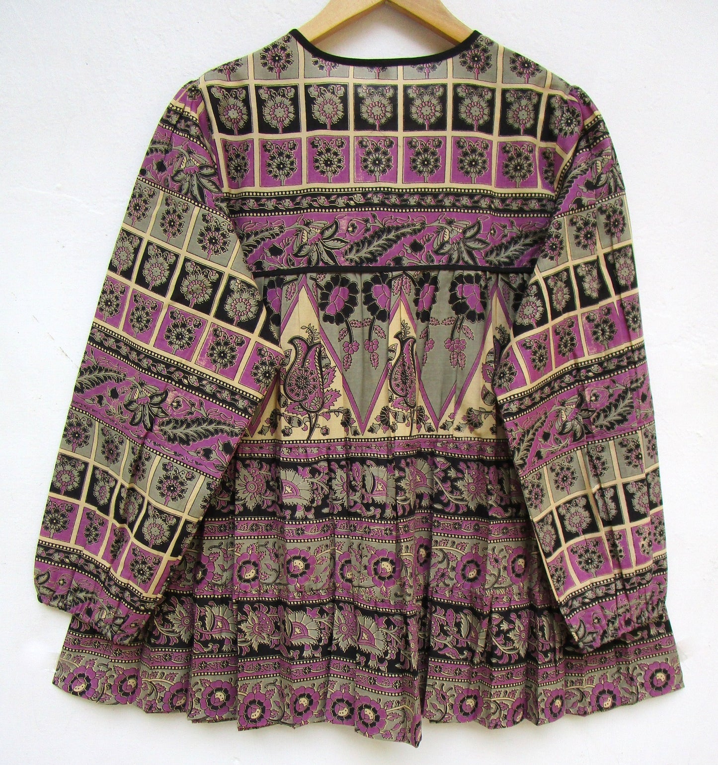 purple womens blouse with black and beige detailing