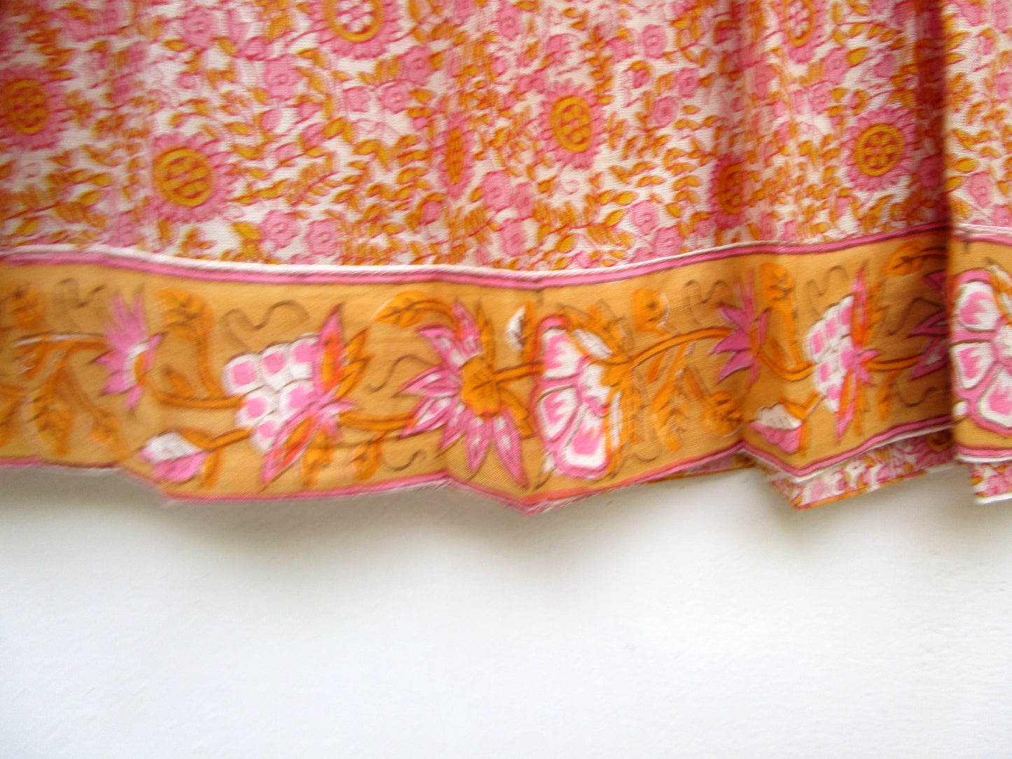 candy orange and pink floral screen printed blouse with tassels