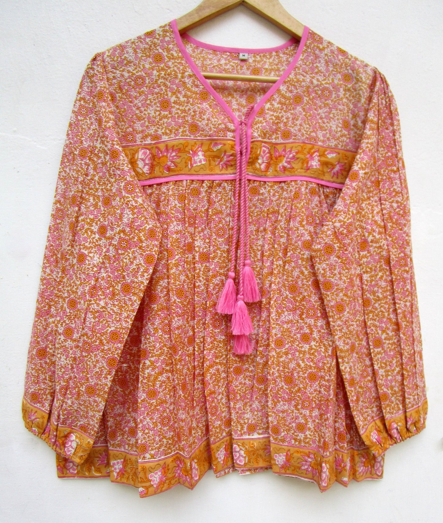 candy orange and pink floral screen printed blouse with tassels