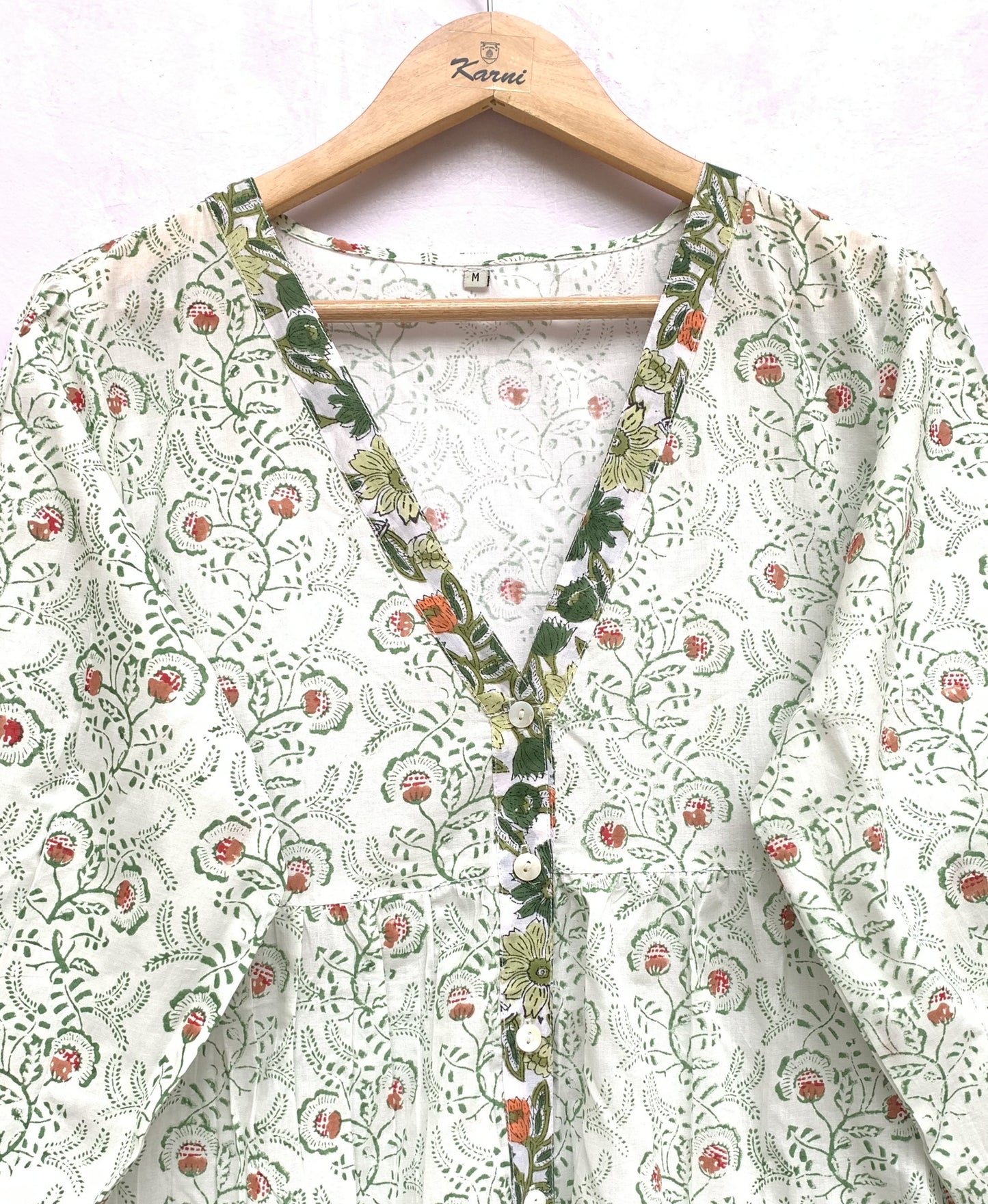 delicate green and white mini cotton dress with a vibrant border