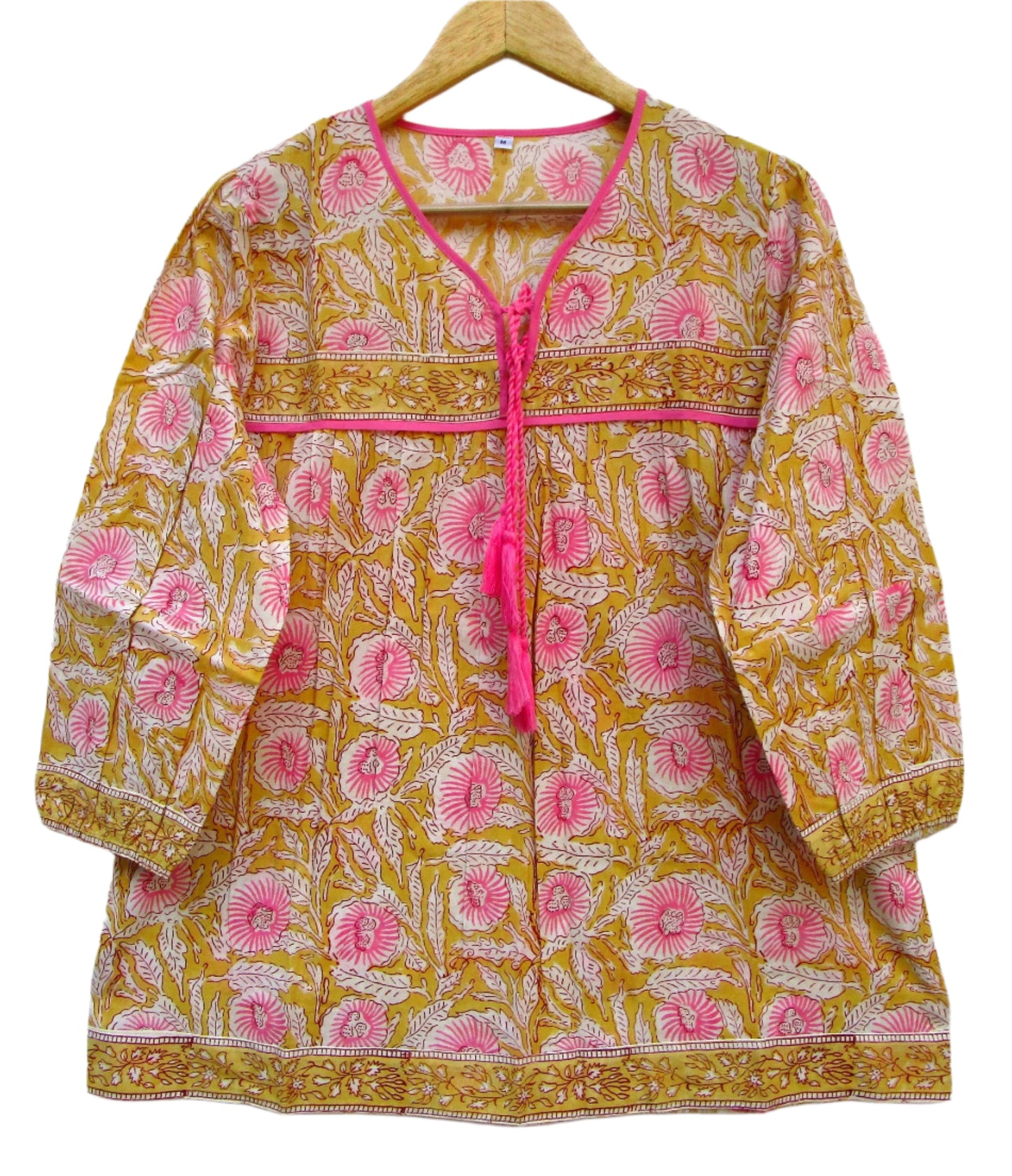 mustard blouse with pink floral pattern