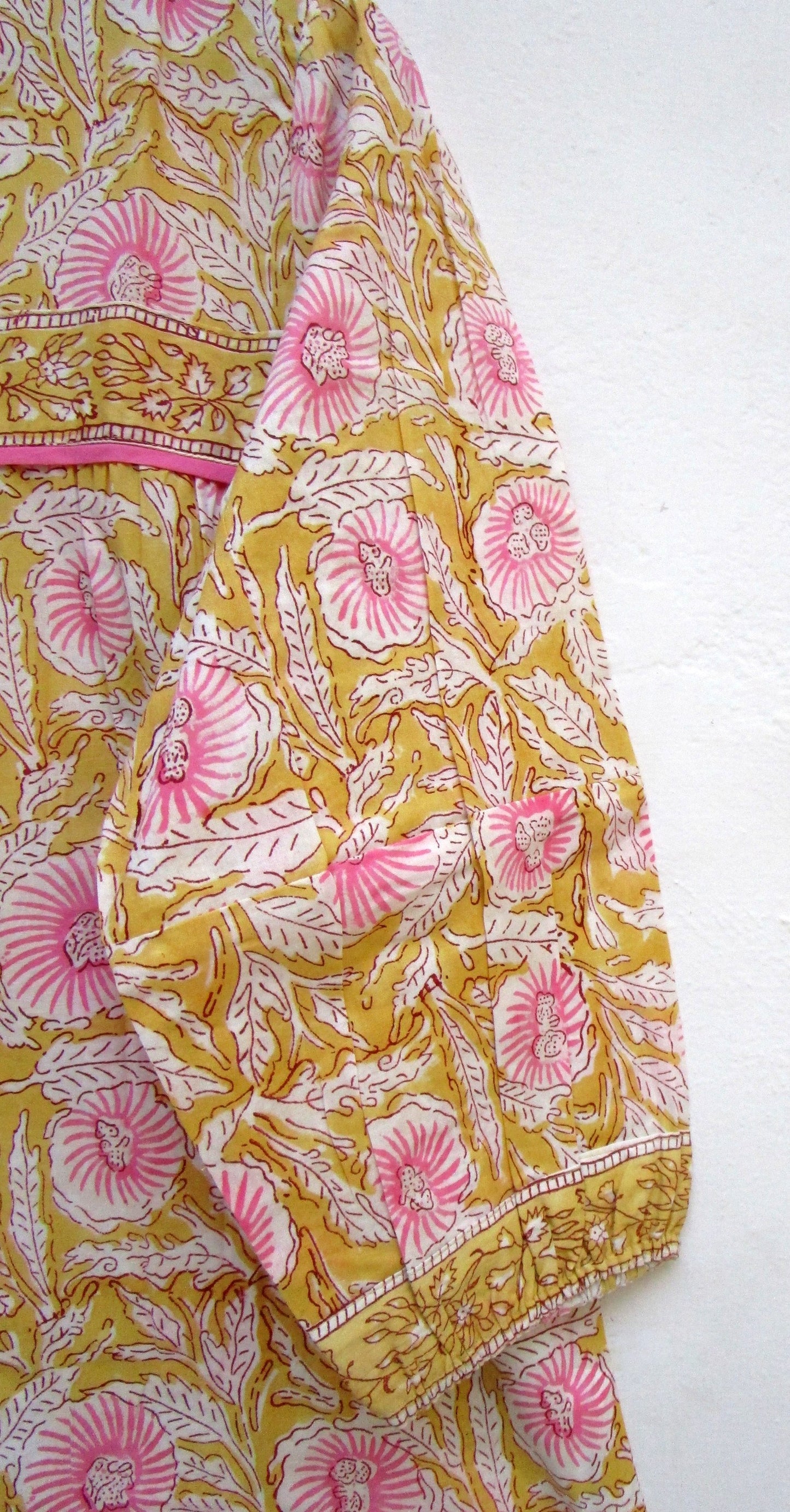mustard blouse with pink floral pattern