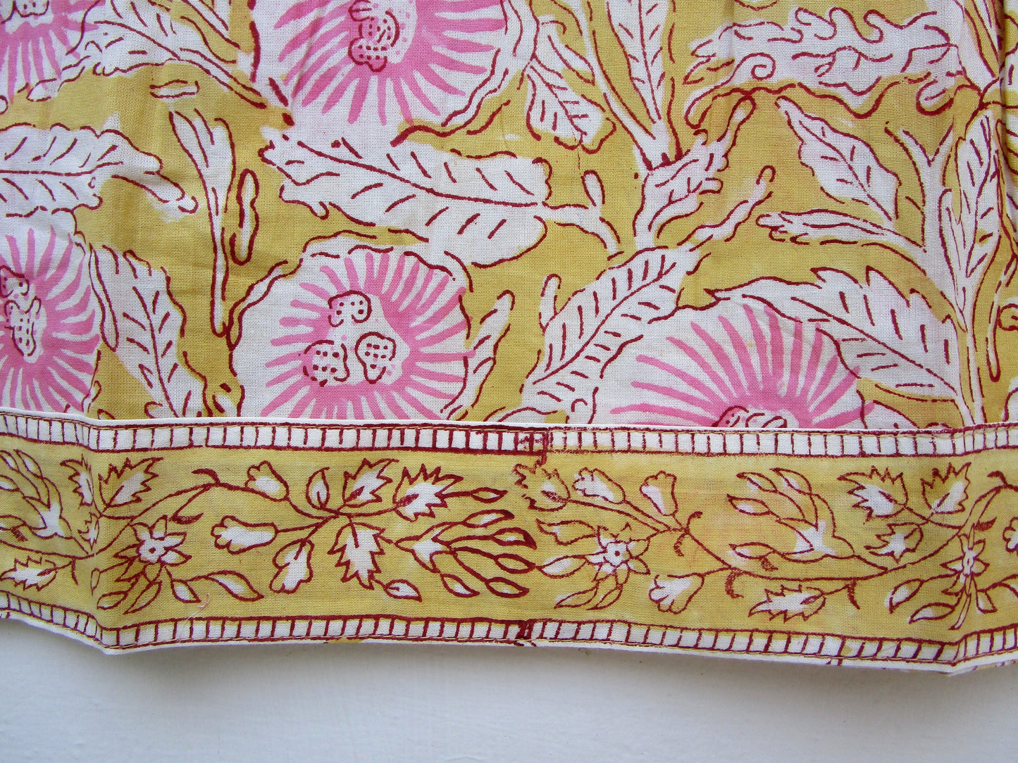 mustard blouse with pink floral pattern