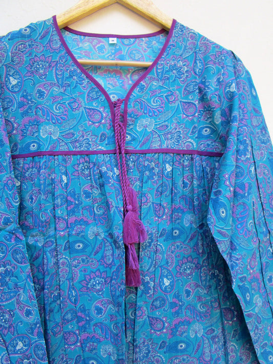 blue screen printed blouse with purple tassels