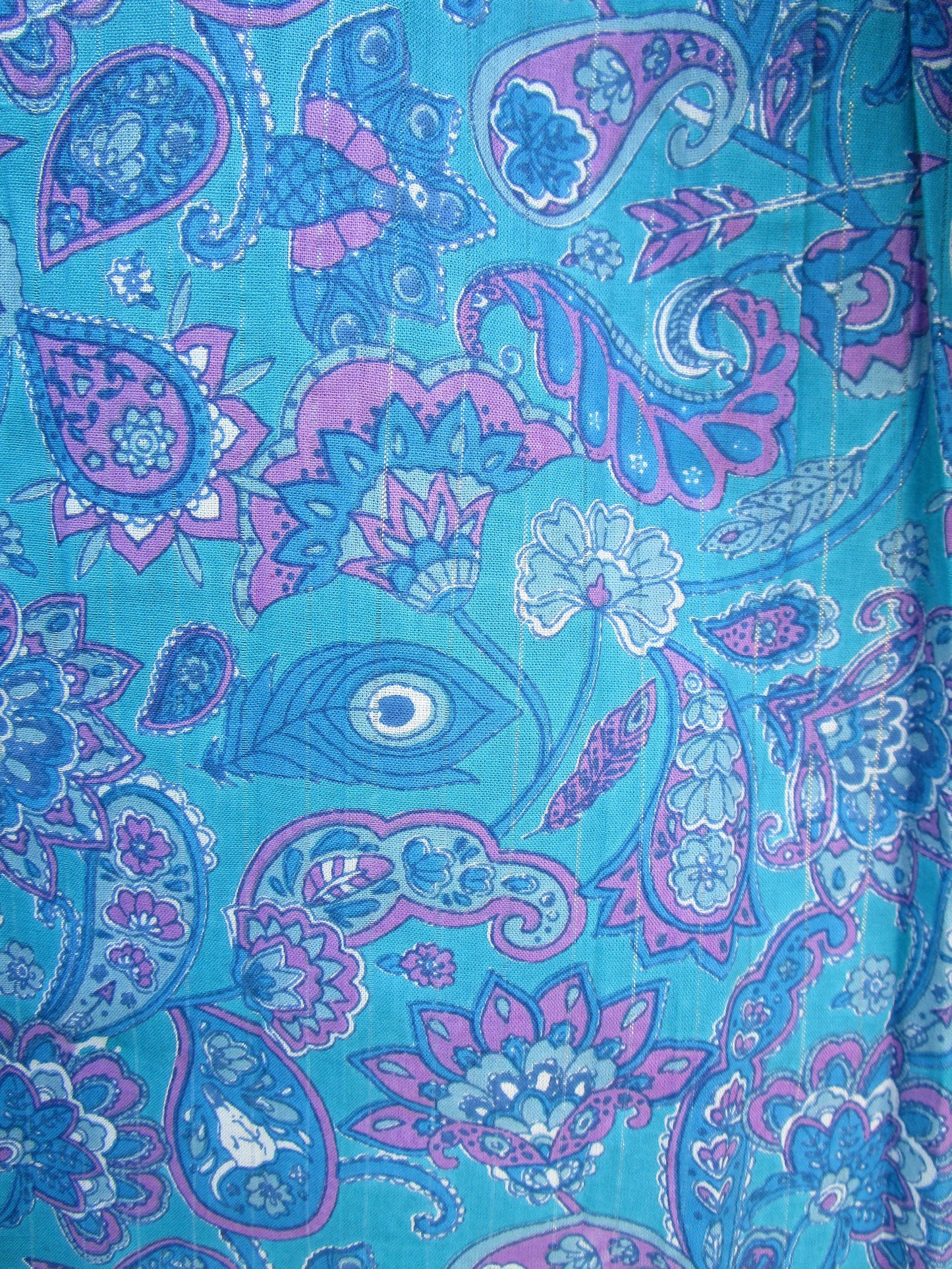 blue screen printed blouse with purple tassels