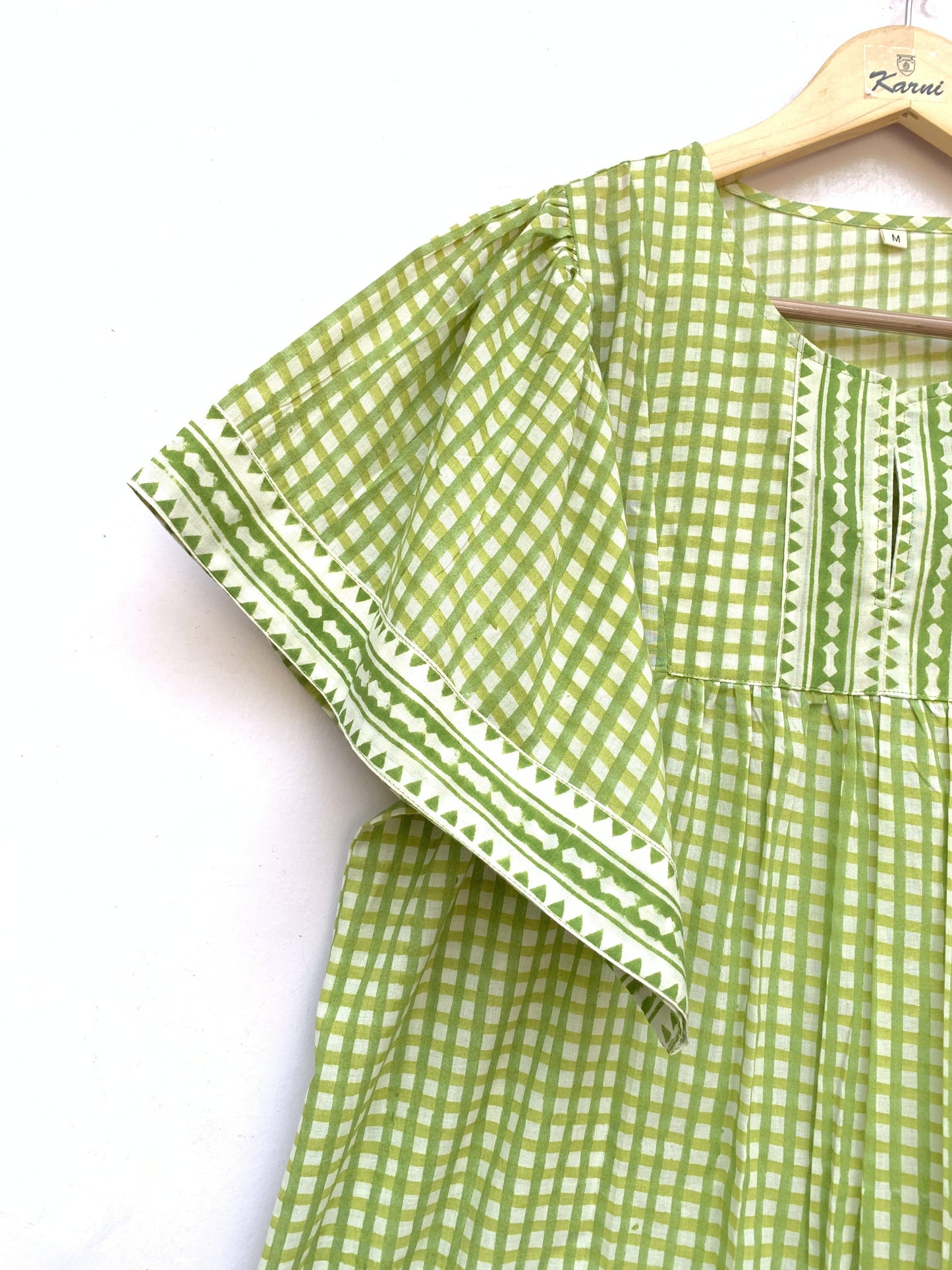 green plaid cotton blouse with v neck and short sleeves