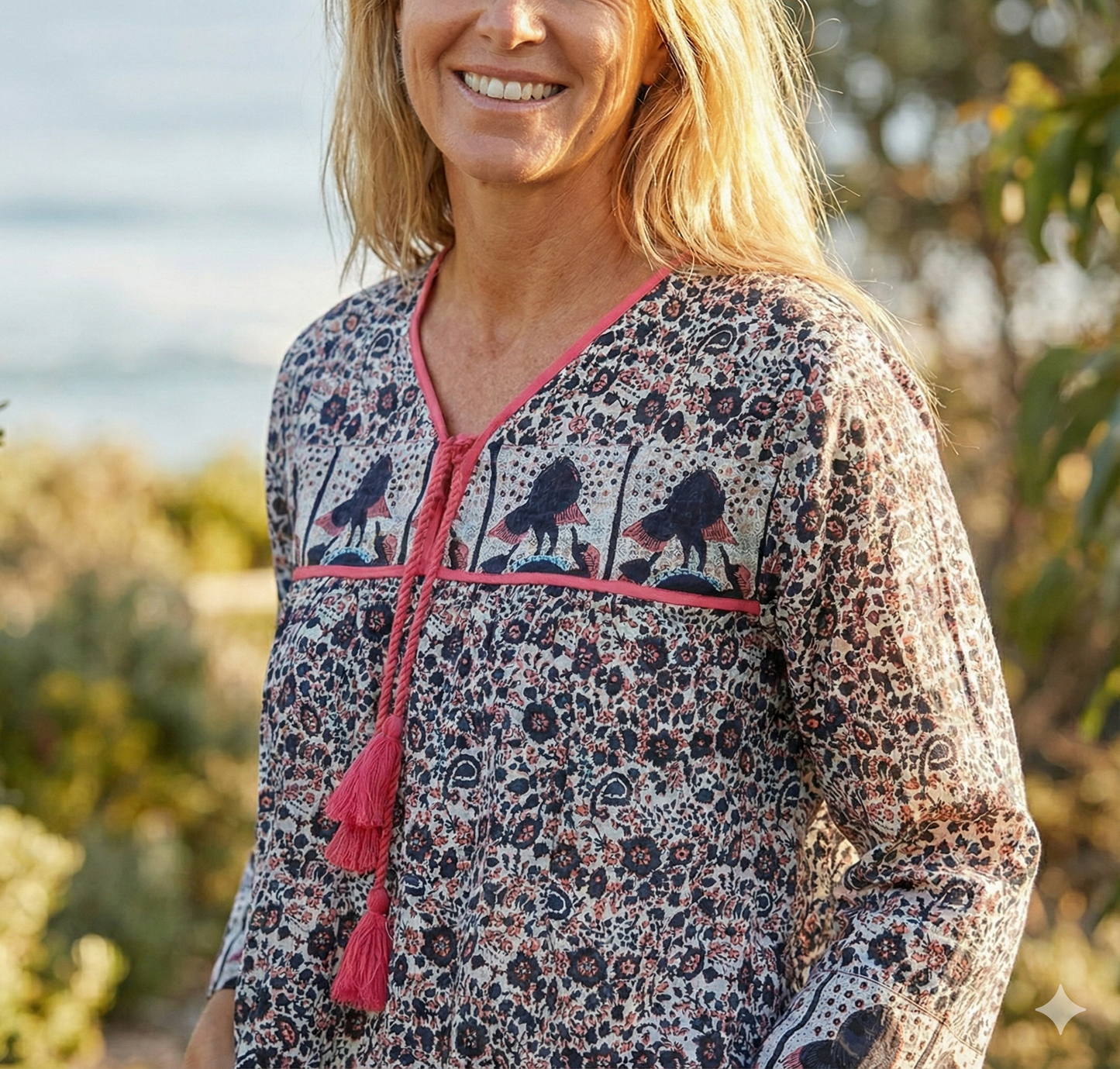 black small flower print blouse with tassels