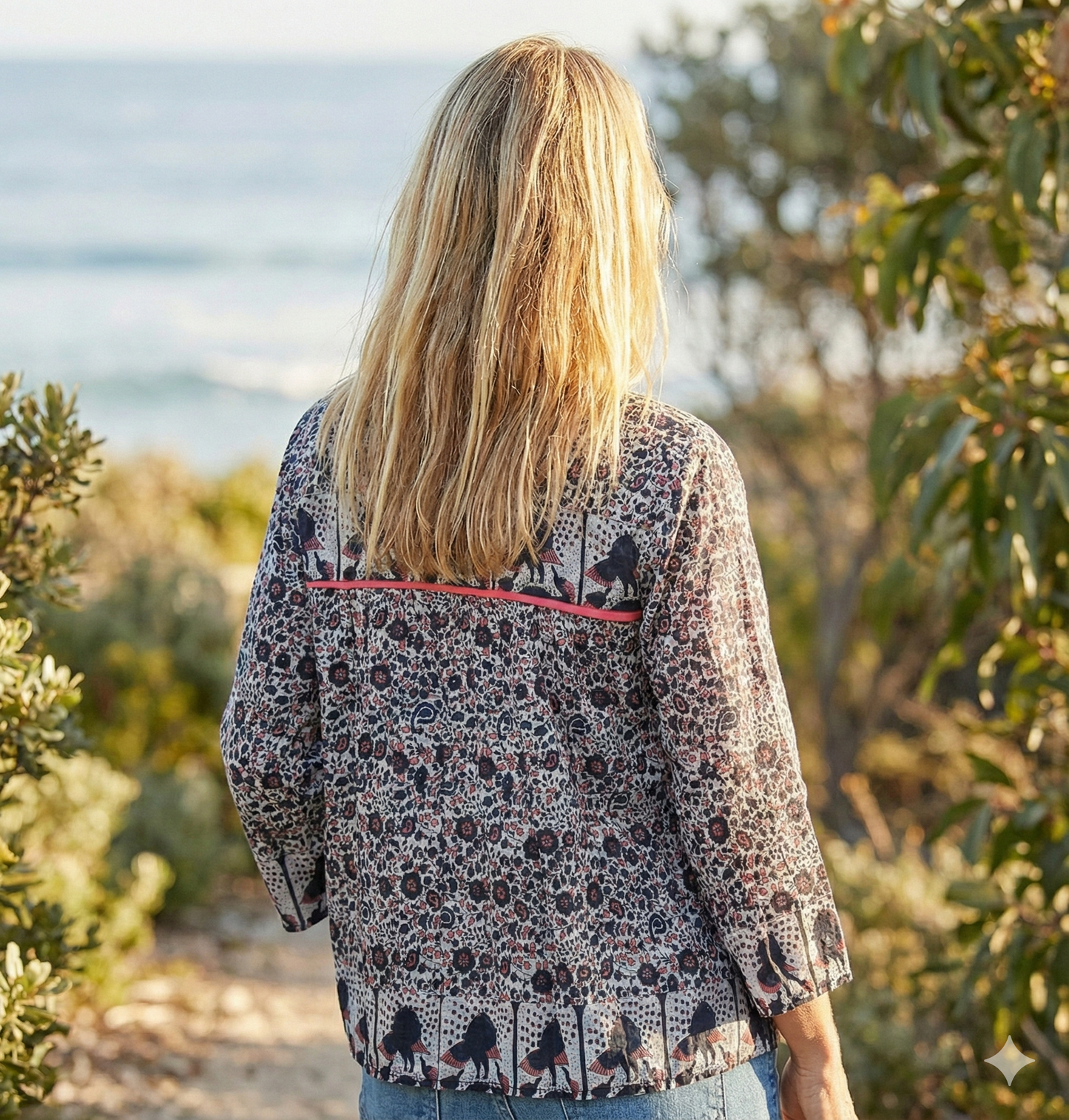 black small flower print blouse with tassels