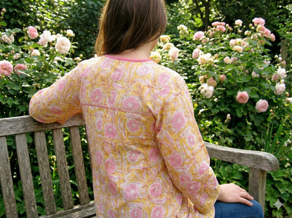 mustard blouse with pink floral pattern
