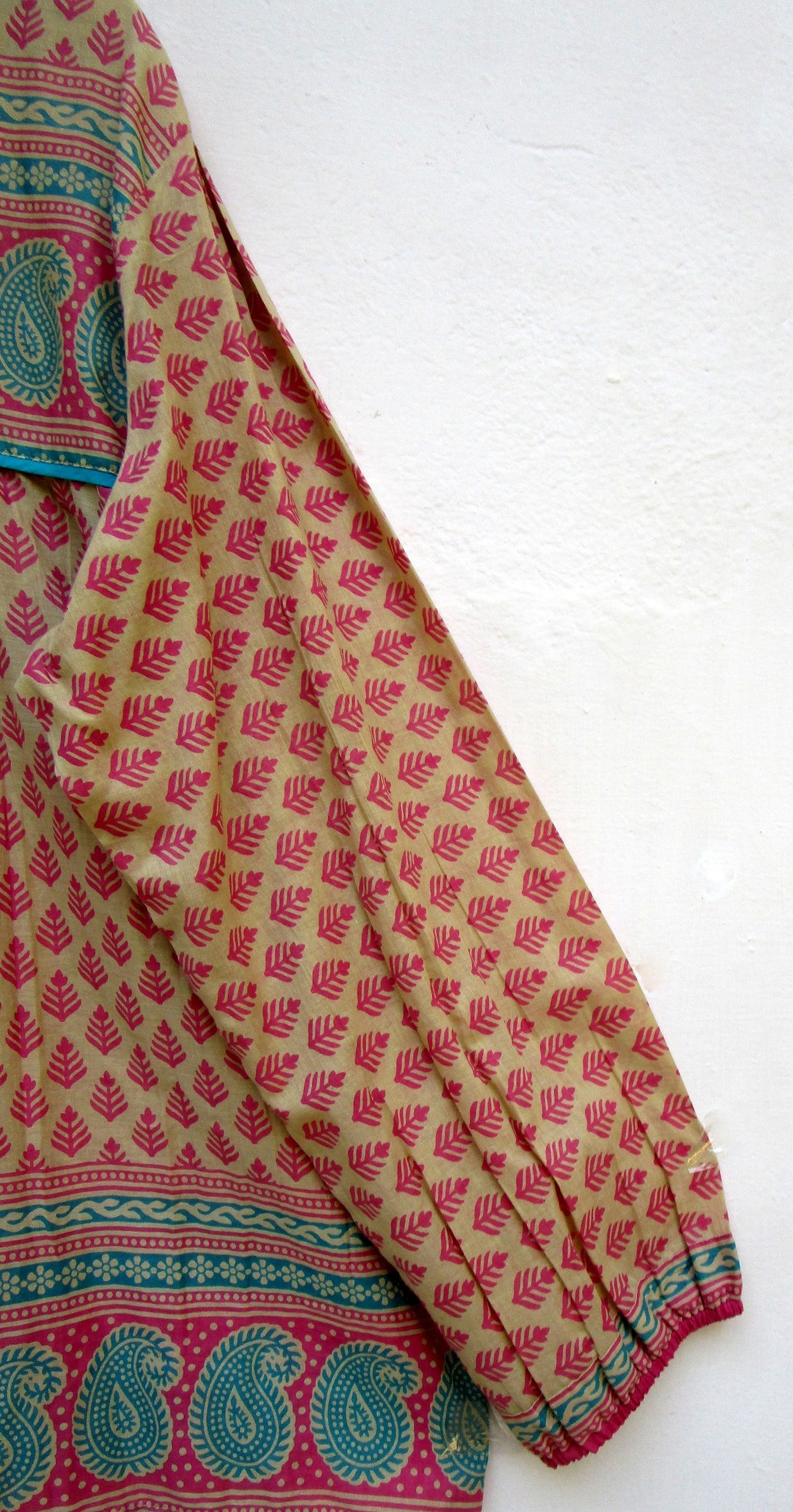 indian screen print blouse with blue paisley motifs and long sleeves