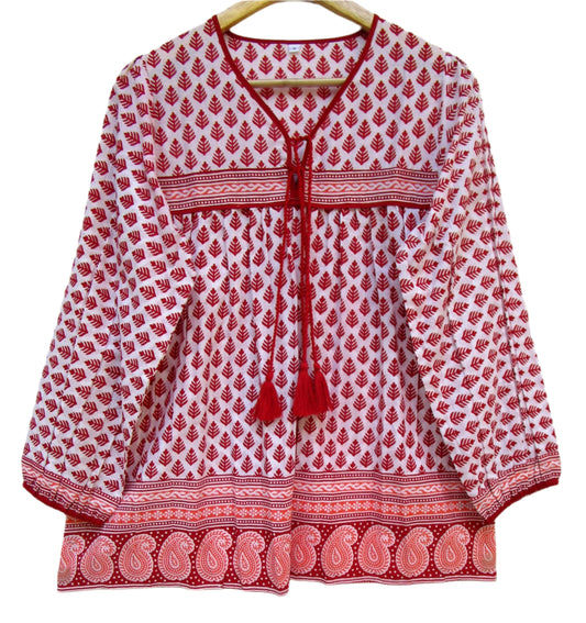 red and white blouse with tassels and a paisley border