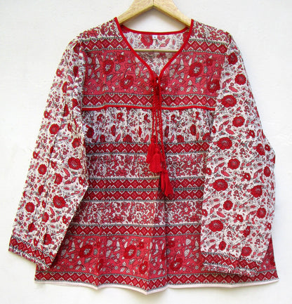 red and white screen printed blouse with long sleeves and tassels