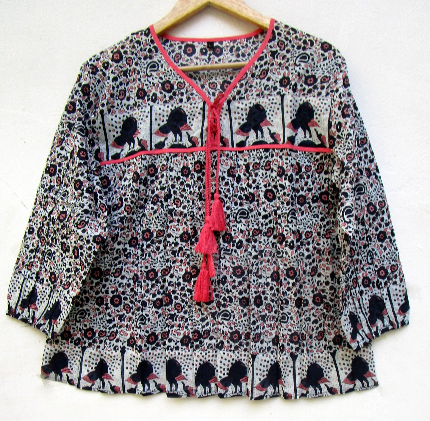 black small flower print blouse with tassels