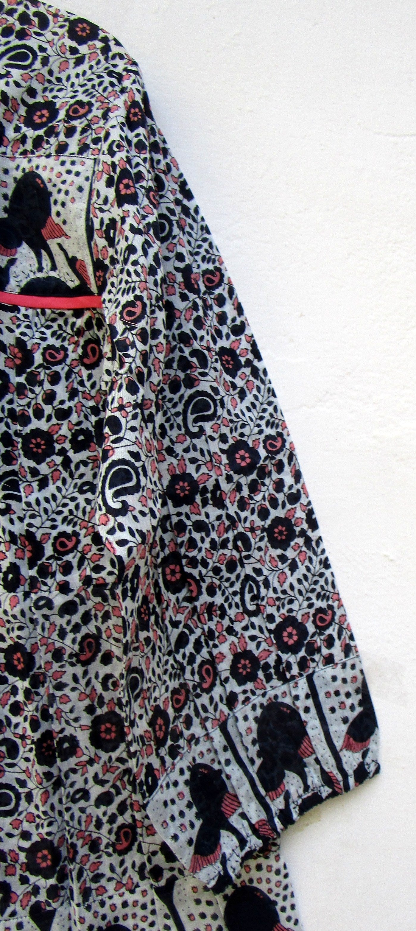 black small flower print blouse with tassels