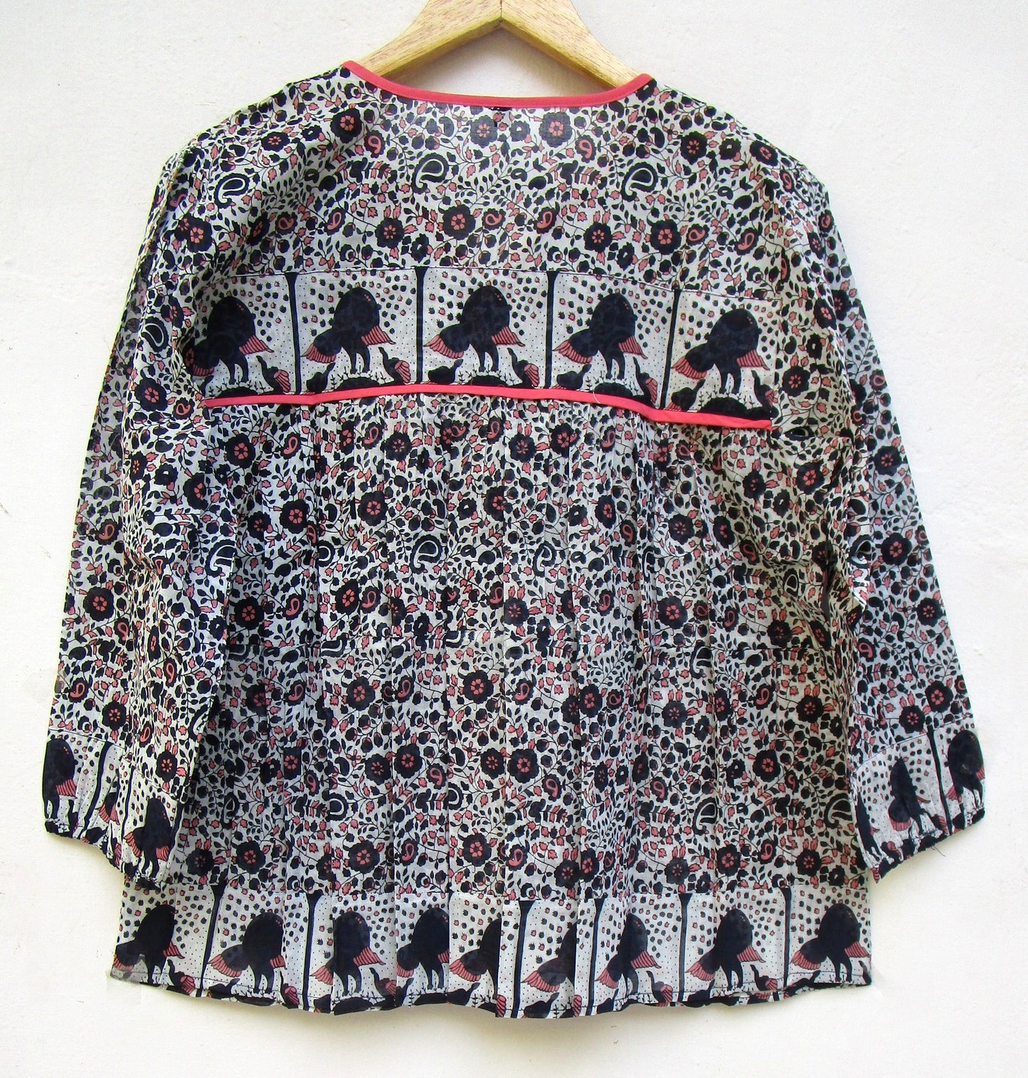 black small flower print blouse with tassels