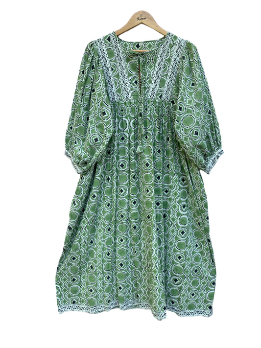 green mini dress with round and diamond pattern
