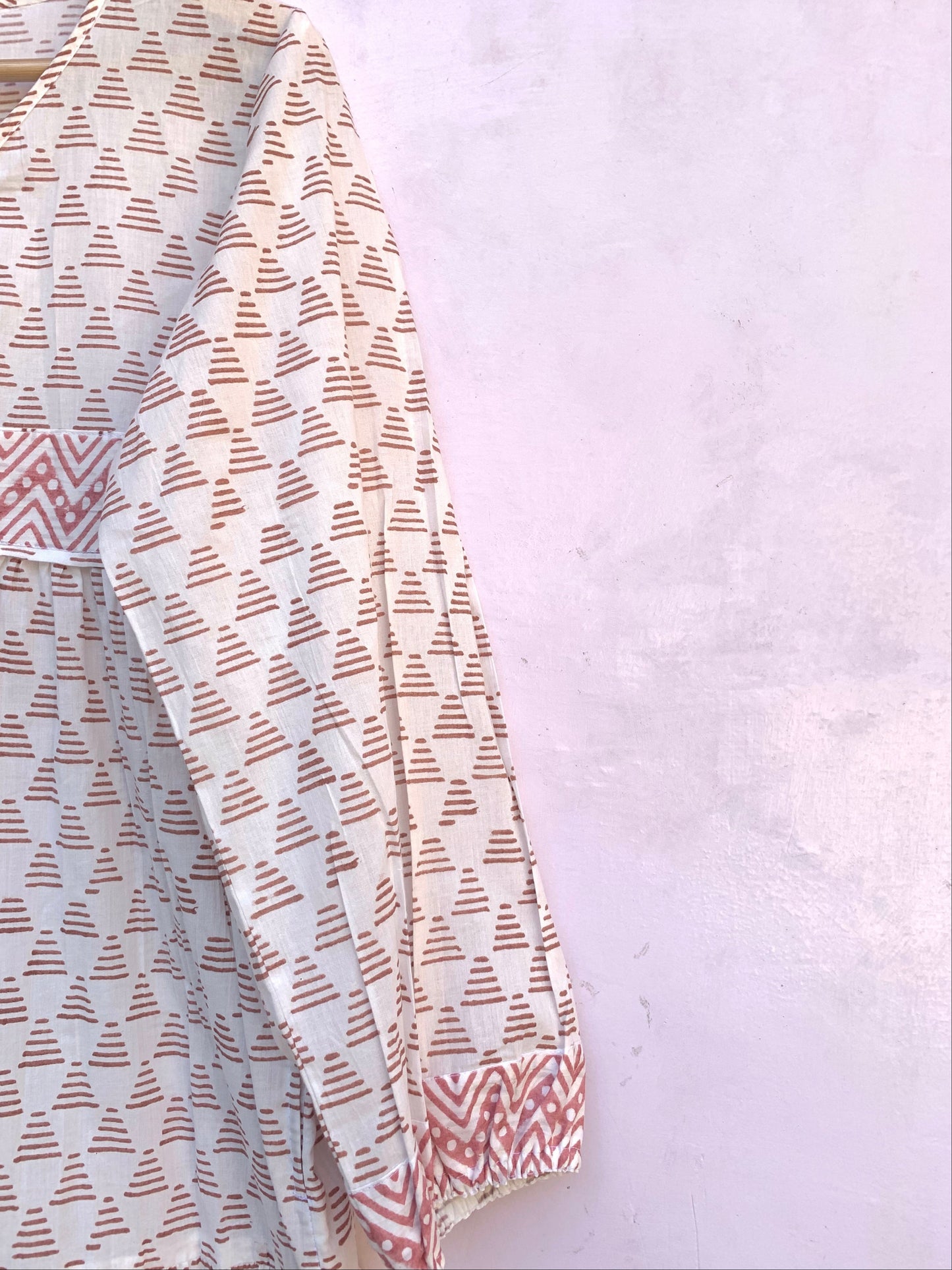 white geometric print maxi dress with tassels and long sleeves