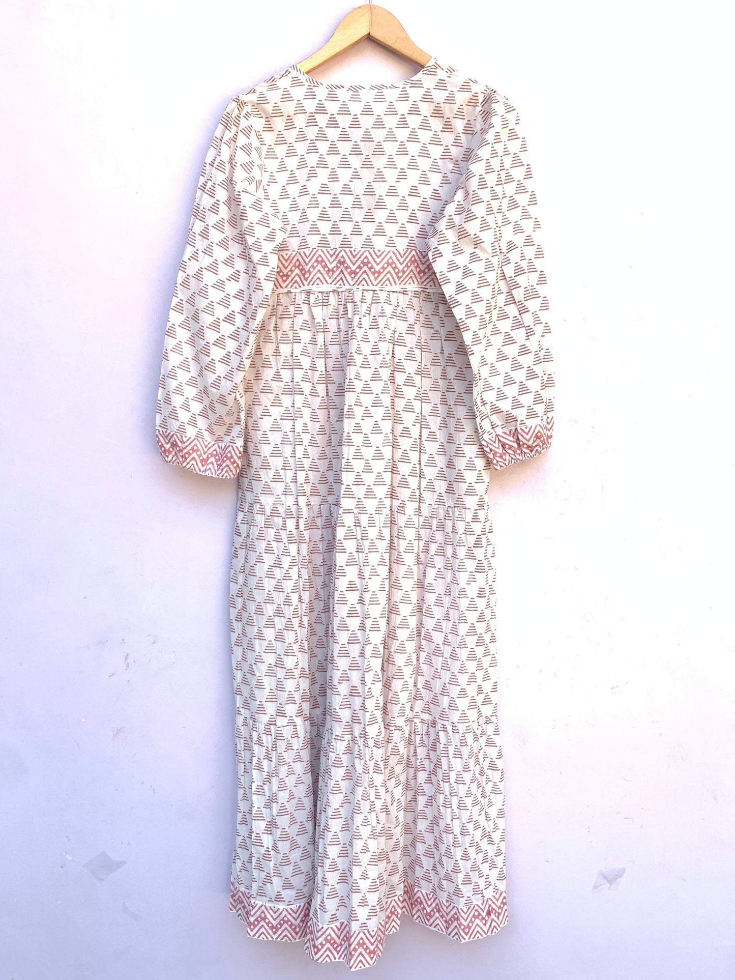 white geometric print maxi dress with tassels and long sleeves