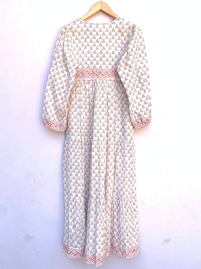 white geometric print maxi dress with tassels and long sleeves