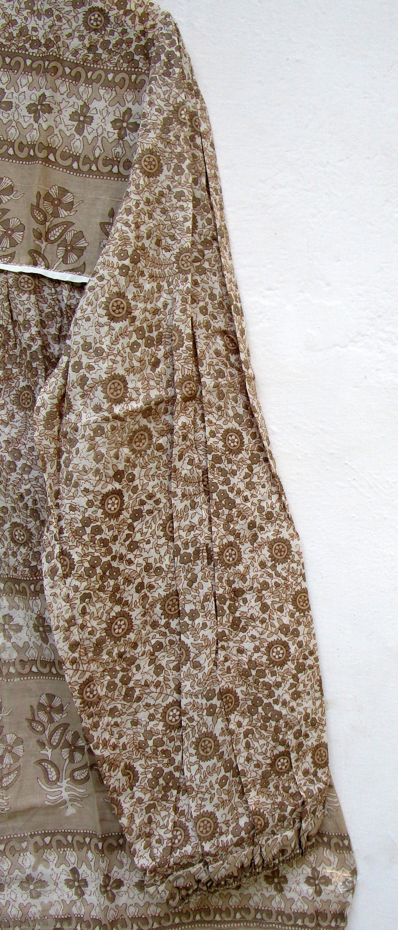 brown screen printed blouse for women with beige tassels