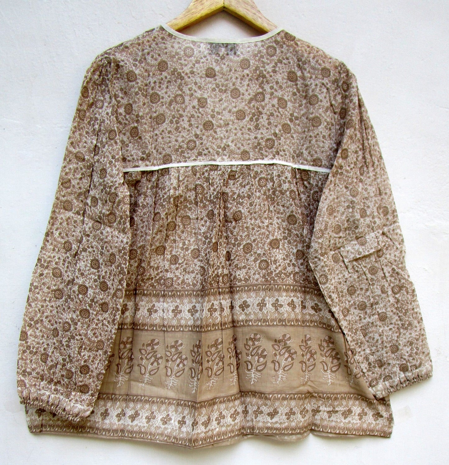 brown screen printed blouse for women with beige tassels