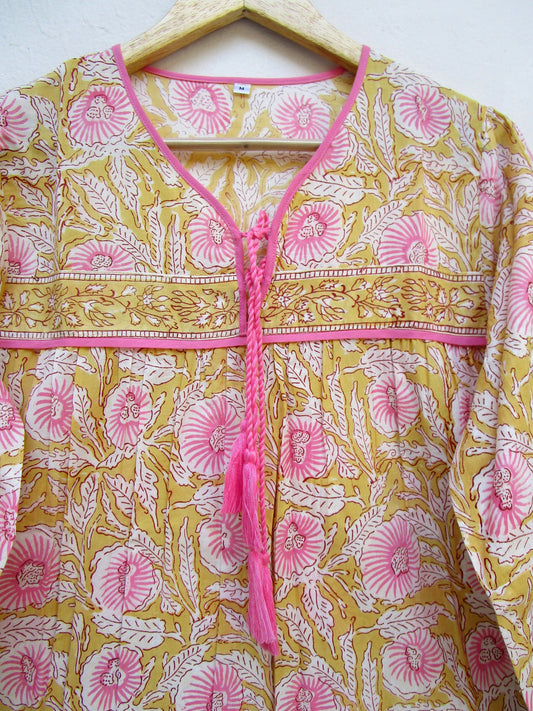 mustard blouse with pink floral pattern