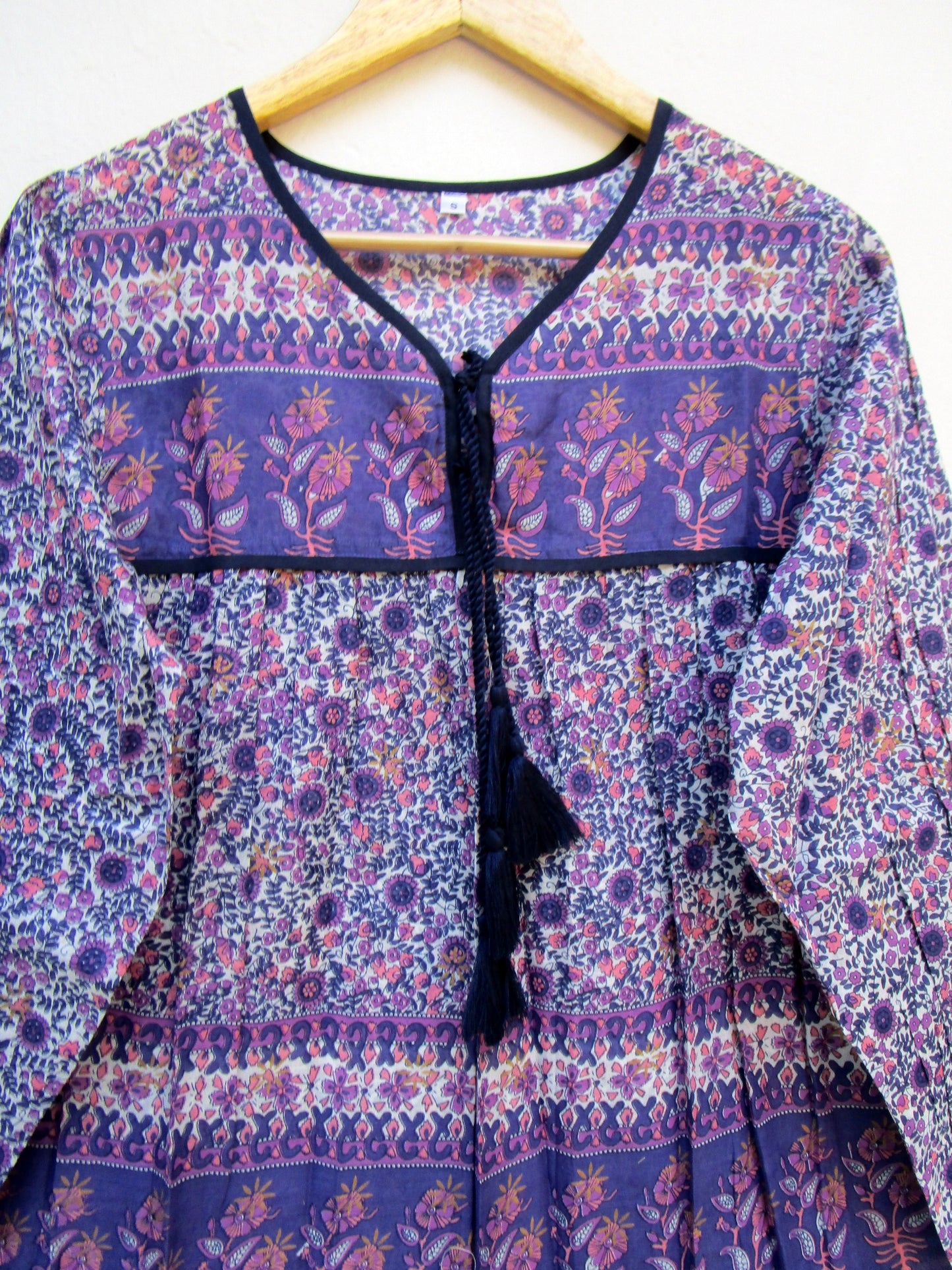 purple screen print blouse with tassels