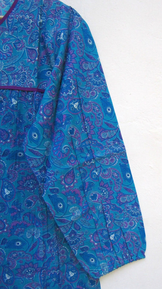 blue screen printed blouse with purple tassels